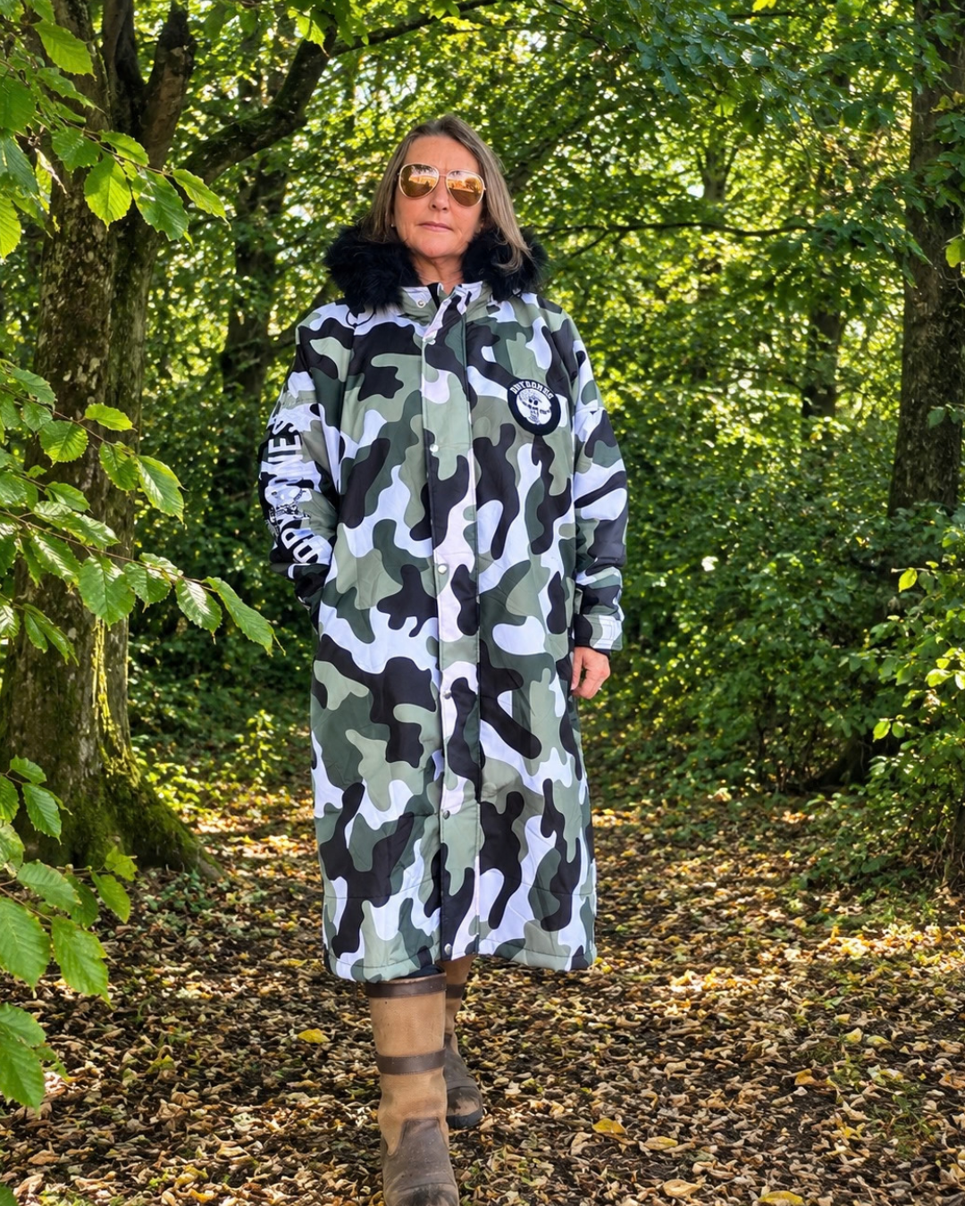 Urban Arctic camo waterproof changing robe with black fur hood and hues of olive green, black, white and grey