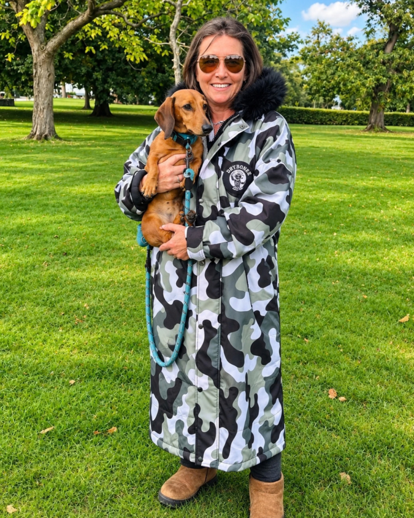 Urban Arctic camo waterproof changing robe with black fur hood and hues of olive green, black, white and grey